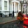 Mink coat & hat , child in front . School cycle run , Chelsea style.